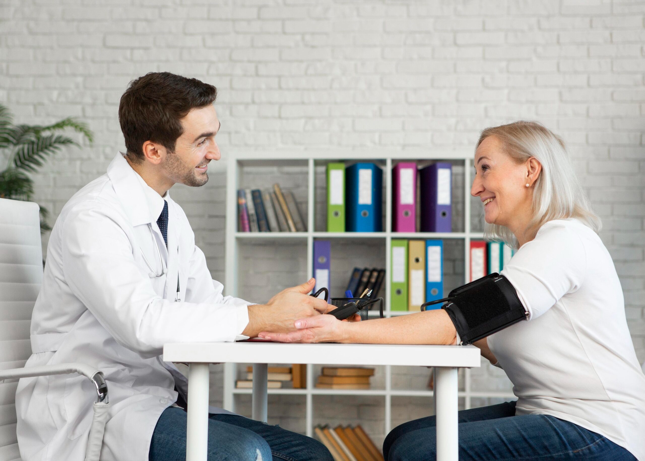 Doctor meeting with patient in clinic