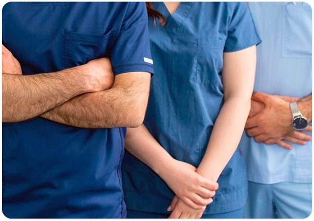 Home healthcare professional standing with folded arms